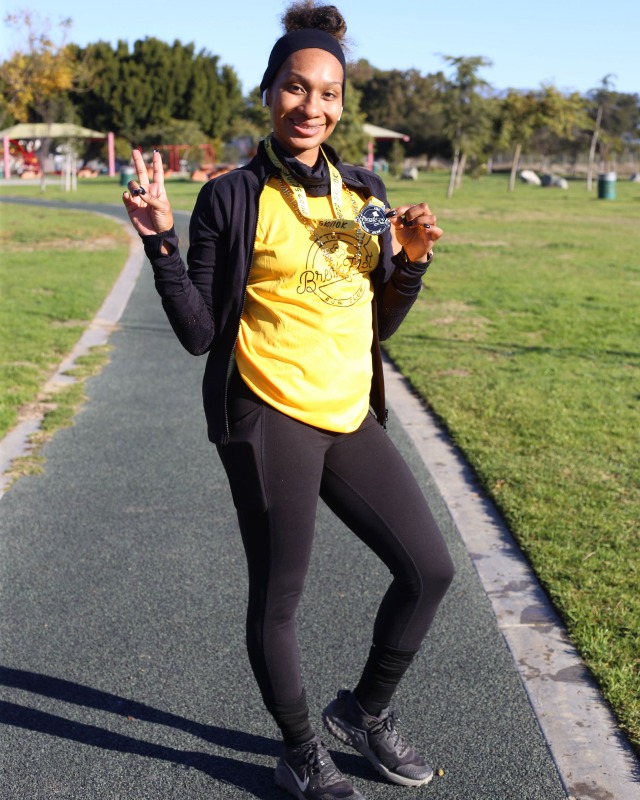 runner holding medal